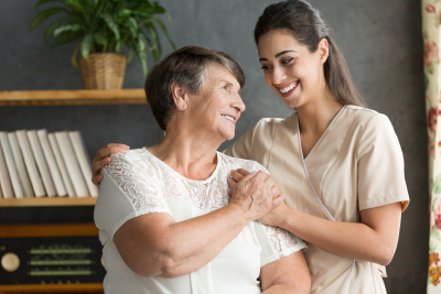 caregiver and senior smiling